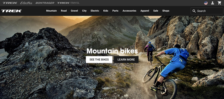 Trek website homepage displaying mountain bikes category with cyclist promotional image