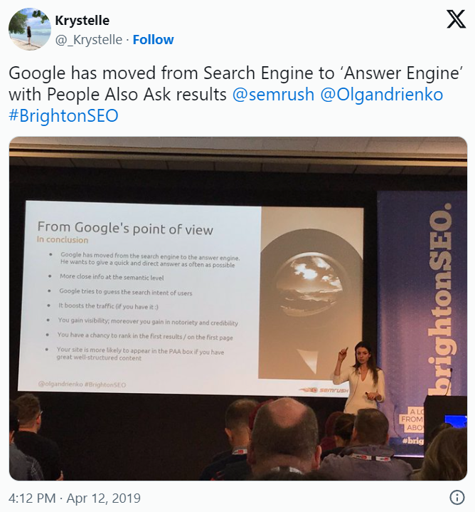 BrightonSEO presenter at podium showing slide about Google's search engine evolution