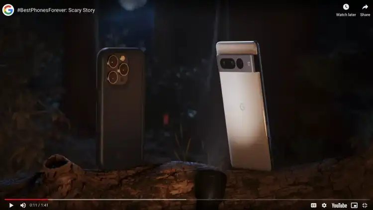 Google phone video ad with iPhone and Pixel around campfire discussing AI features