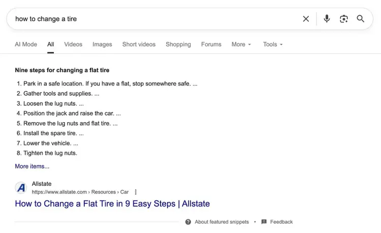 SERP for the term "how to change a tire" yielding a featured snippet which directly answers the user's question.