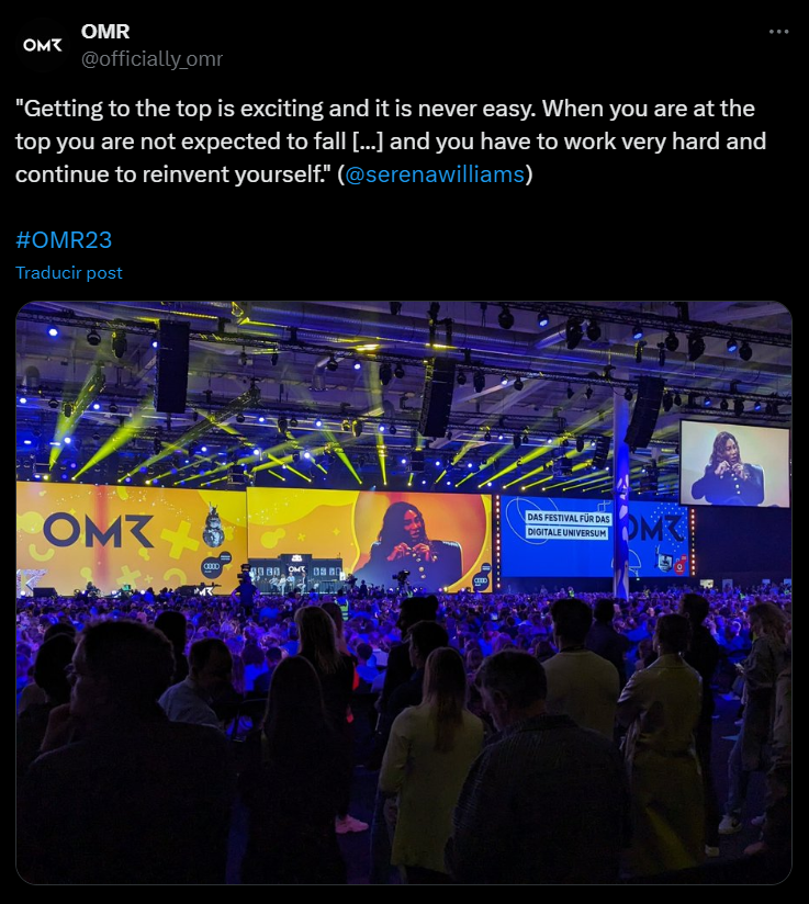 OMR conference Twitter post showing large stage with OMR signage and audience crowd