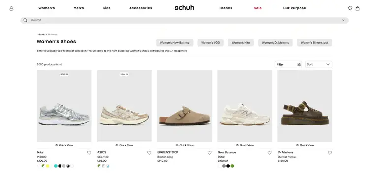 The "women's shoes" category page on the Schuh website showing a list of related products.