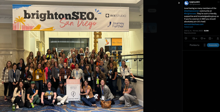 Large group photo of BrightonSEO San Diego attendees at event under conference banner