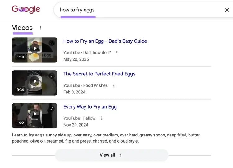 Google SERP with "how to fry eggs" entered triggering video results.