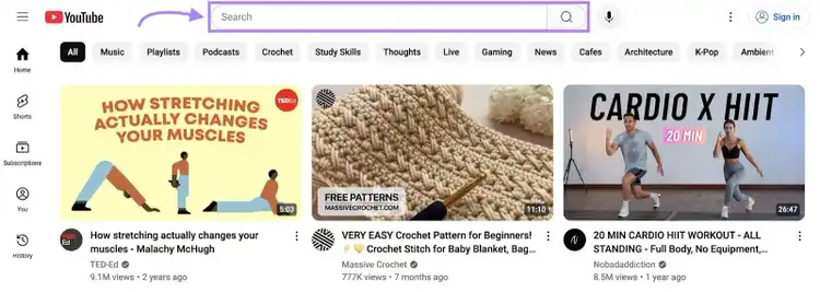The YouTube home page with the search bar on top highlighted.