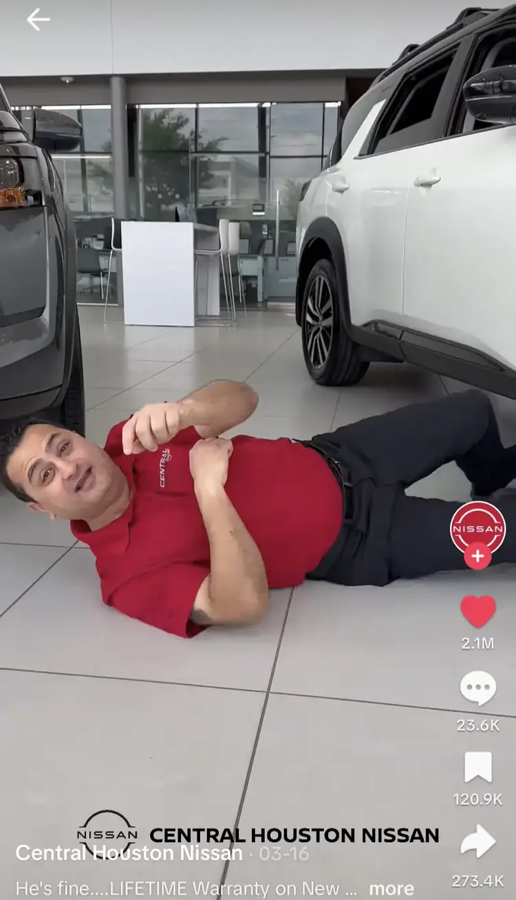 Central Houston Nissan video ad with person falling off stretcher in showroom