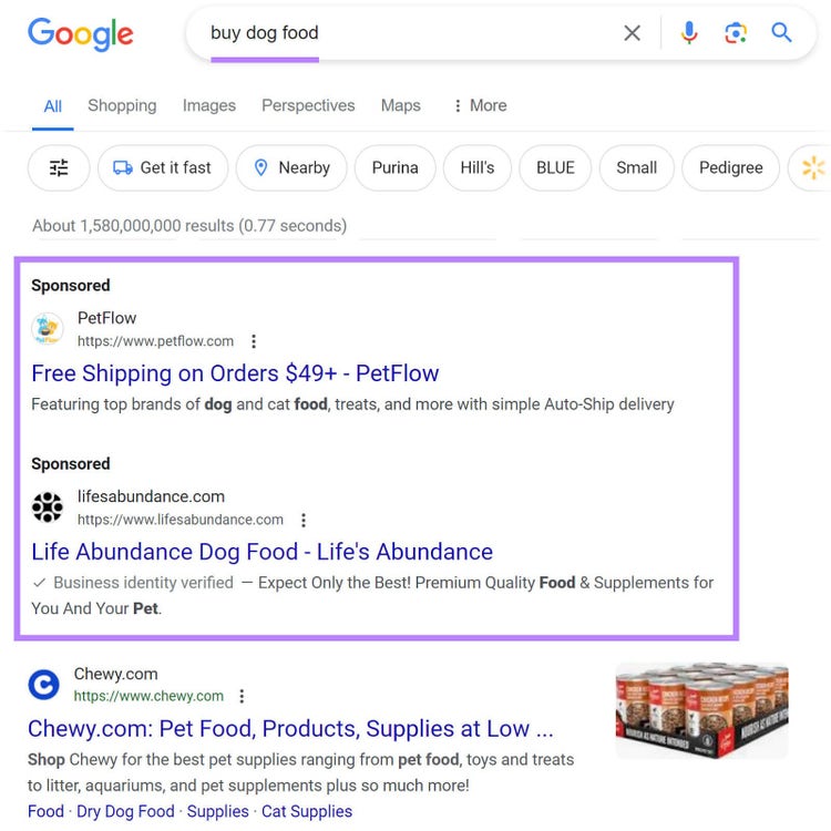 Search ads appearing on Google for "buy dog food" query appearing above the organic search results