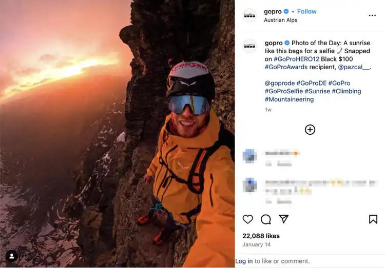 A climber takes a selfie on a small cliff ledge at sunrise which is featured for the social media campaign on Instagram.