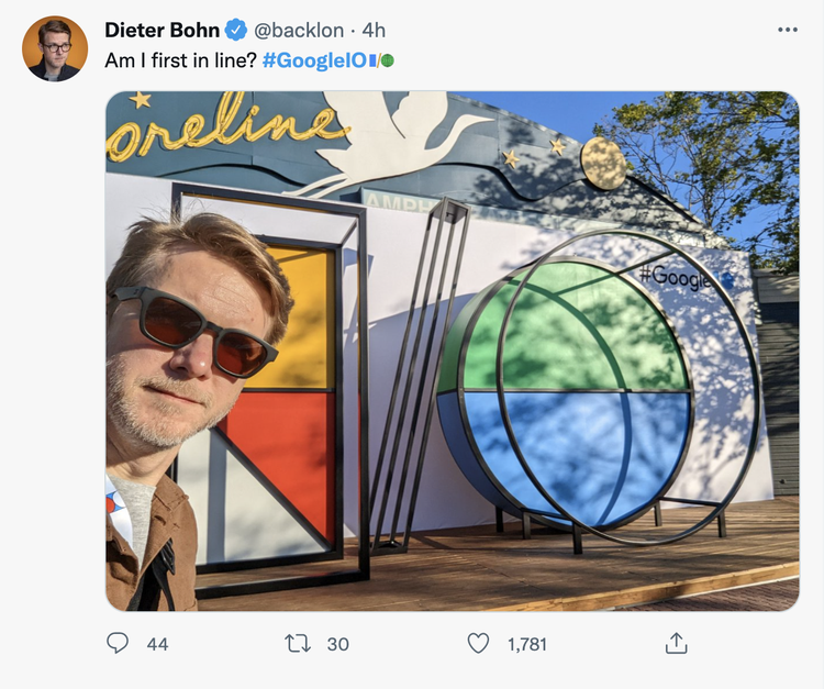 Tweet about Google I/O conference with person at event entrance
