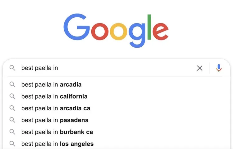 Autocomplete Google per 'best paella in' con suggerimenti città